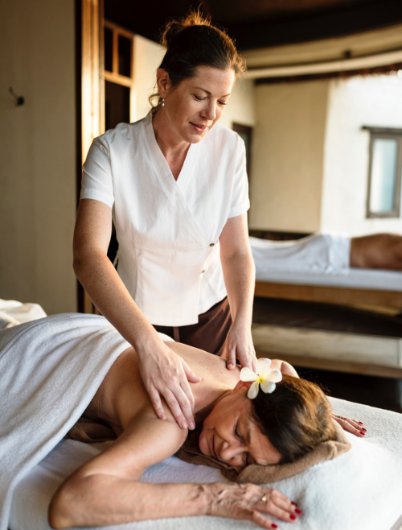 female message therapist giving a massage at a spa W 1.jpg