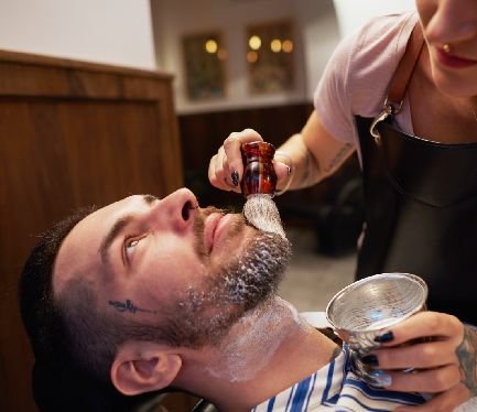 httpselements.envato.comwoman applying shaving cream to mans beard 2Y69F7F.jpg