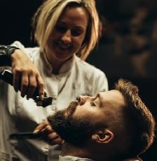 httpselements.envato.comyoung bearded man getting beard haircut by hairdre GZ9BUDN.jpg