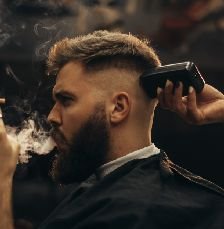 httpselements.envato.comyoung bearded man getting haircut by hairdresser a 5DSEUND.jpg
