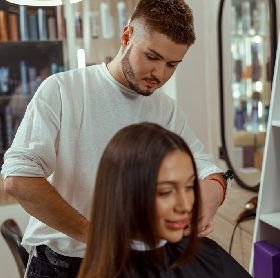 httpselements.envato.comyoung woman getting a haircut by professional male PZFGU3Q 1.jpg
